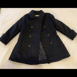 Black dress coat with flare detail